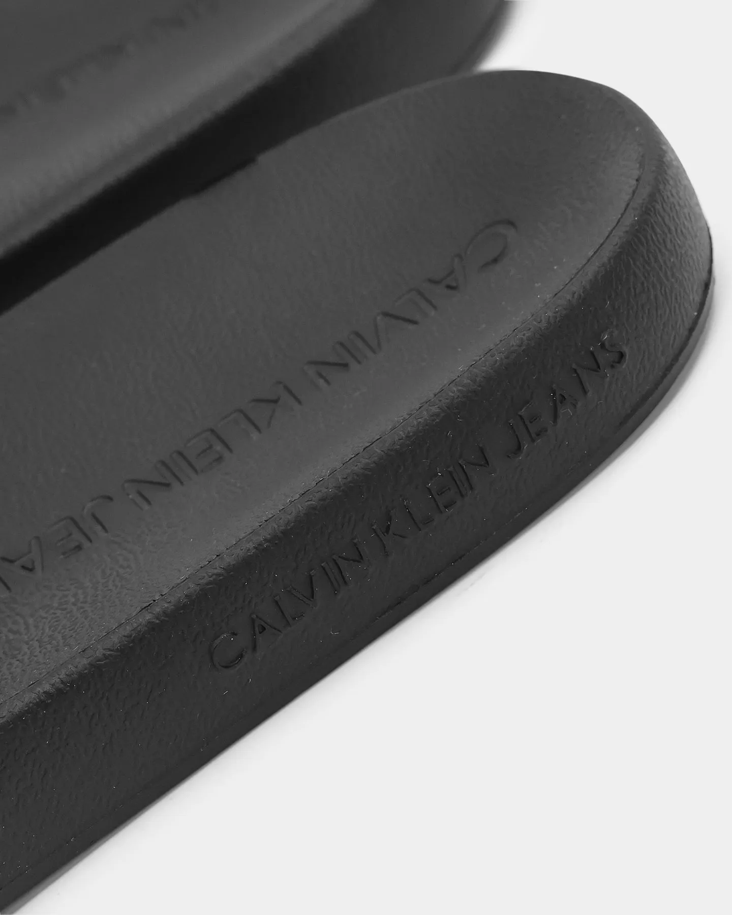 Calvin Klein Monogram Debossed Slides Black